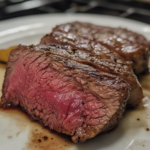 A beautifully plated chuck steak garnished with fresh herbs, served alongside roasted vegetables, showcasing the deliciousness and versatility of this flavorful cut of beef.